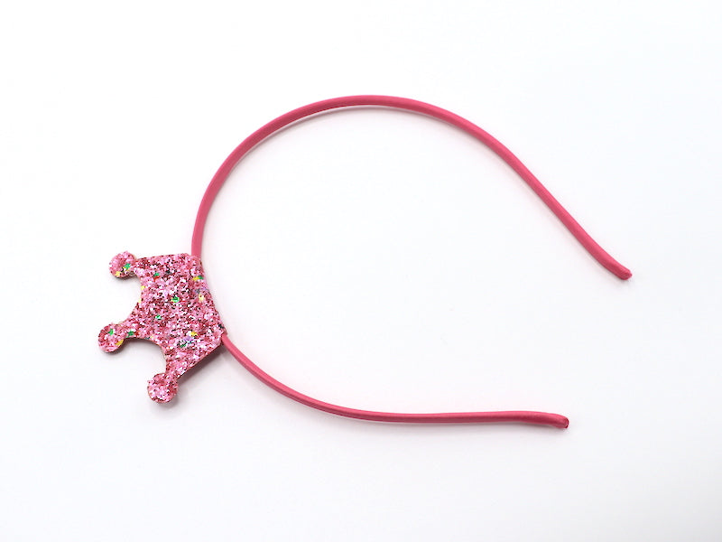 Diadema con corona y purpurina rosa